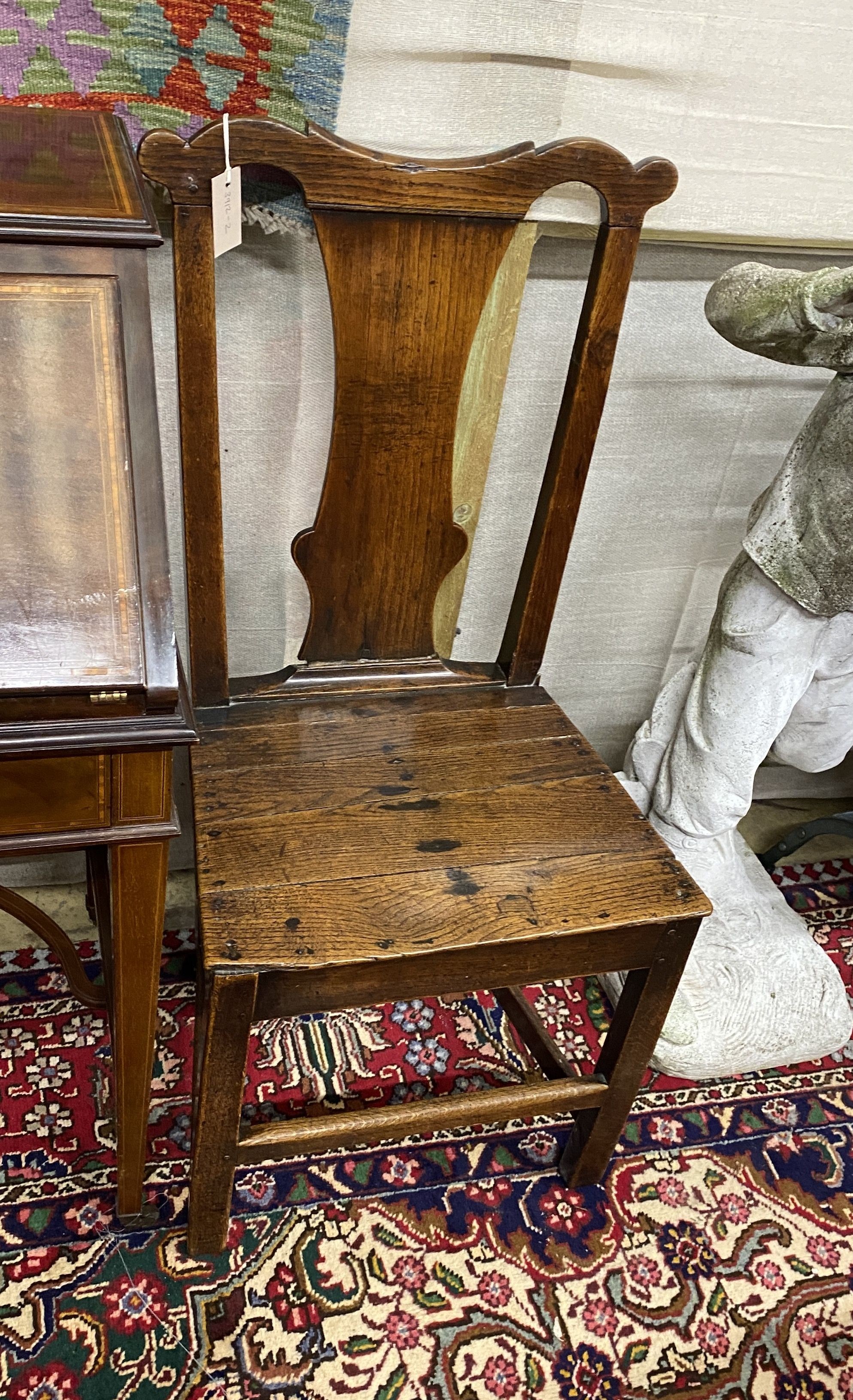 An 18th century oak wood seat chair